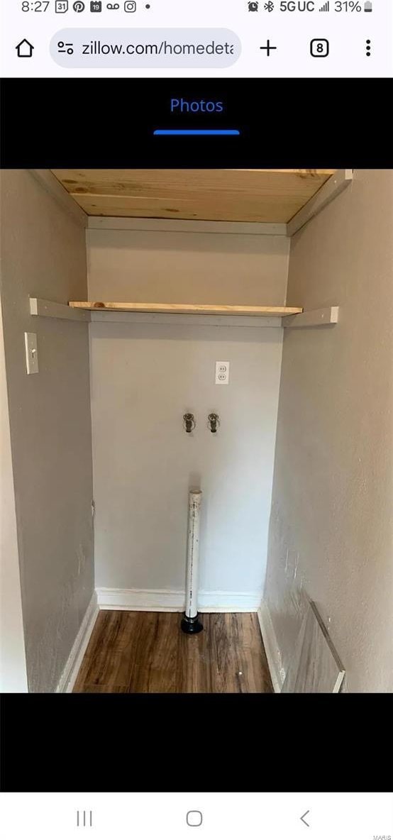 laundry room with laundry area, wood finished floors, and baseboards