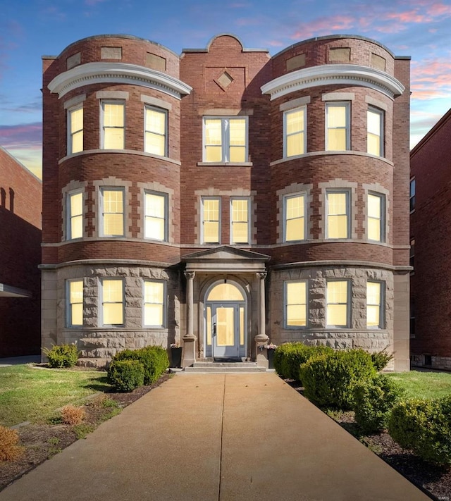 view of front of house featuring brick siding