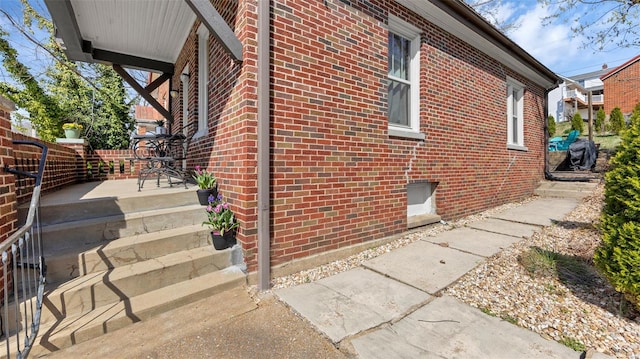 view of home's exterior featuring brick siding