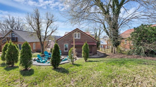 rear view of property with a yard
