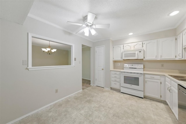kitchen with white cabinetry, ornamental molding, and white appliances