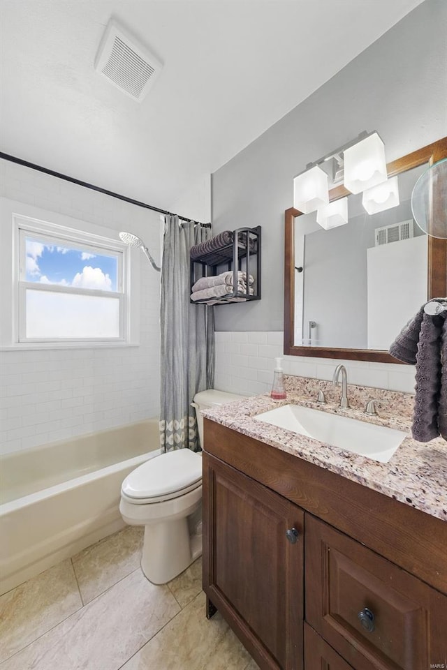 bathroom with vanity, visible vents, toilet, and tile patterned flooring