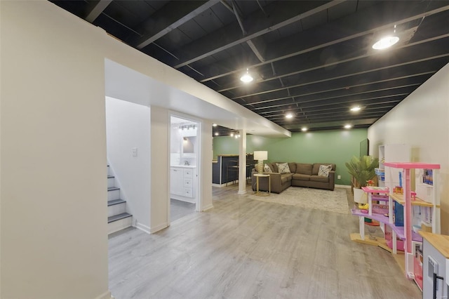 playroom featuring wood finished floors and baseboards