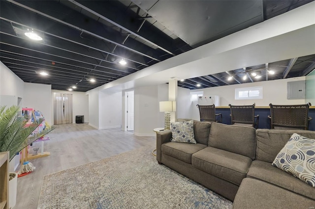 living room with baseboards and wood finished floors