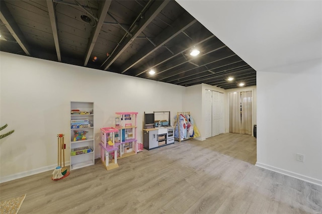 game room with wood finished floors and baseboards
