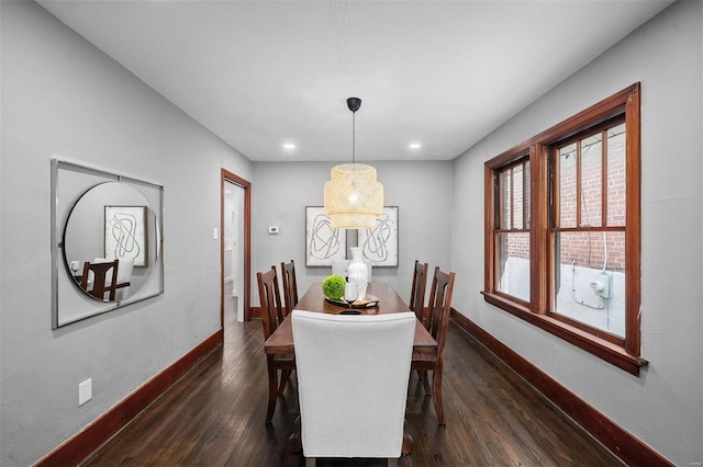 dining space with recessed lighting, baseboards, and dark wood-style floors