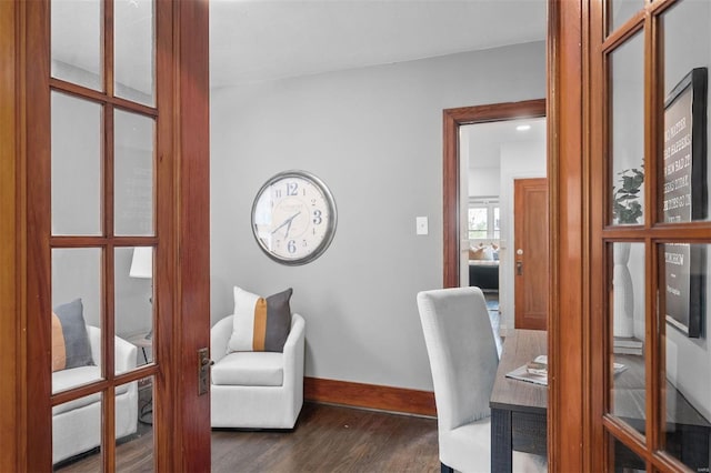 home office featuring french doors, dark wood finished floors, and baseboards