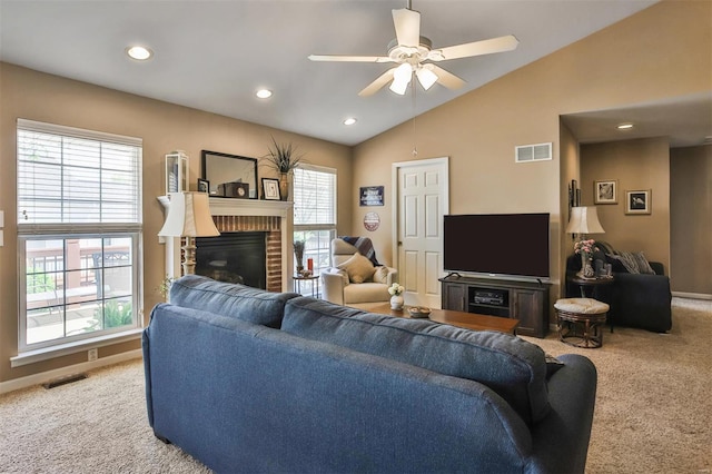 living area featuring a ceiling fan, visible vents, and carpet