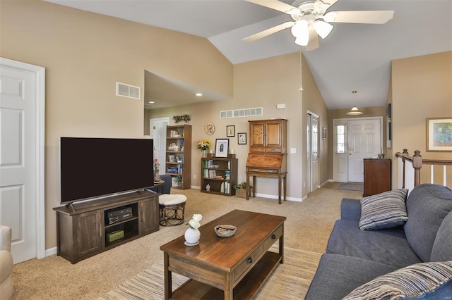 carpeted living room with baseboards, a ceiling fan, visible vents, and high vaulted ceiling