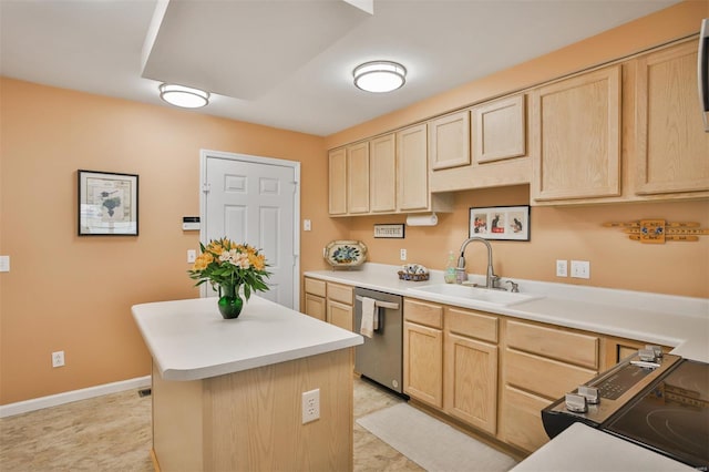 kitchen with light brown cabinets, stainless steel dishwasher, a center island, and a sink