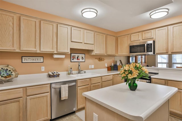 kitchen with light brown cabinets and appliances with stainless steel finishes