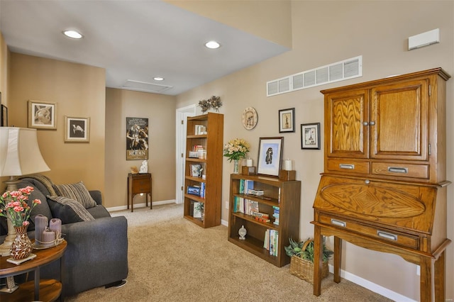 living area with attic access, baseboards, visible vents, recessed lighting, and light colored carpet