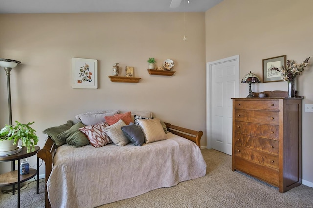 carpeted bedroom featuring baseboards