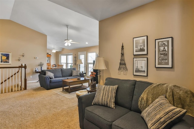 living room with lofted ceiling, baseboards, carpet, and ceiling fan