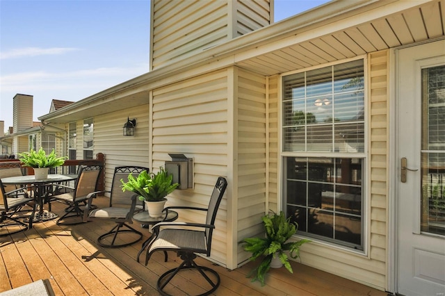 wooden deck with outdoor dining space