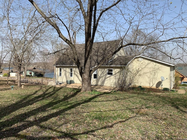 view of property exterior with a yard