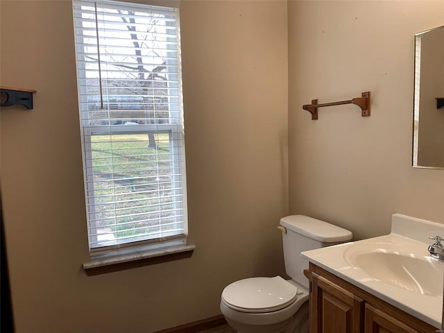 bathroom featuring toilet and vanity