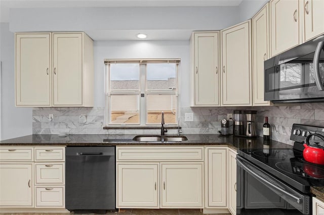 kitchen featuring dishwashing machine, cream cabinets, black range with electric cooktop, and a sink