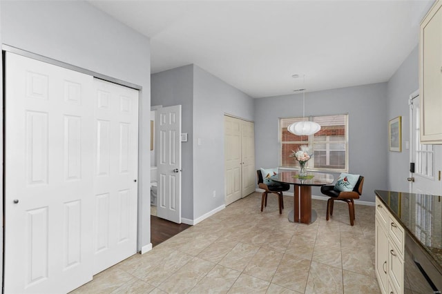 dining room featuring baseboards