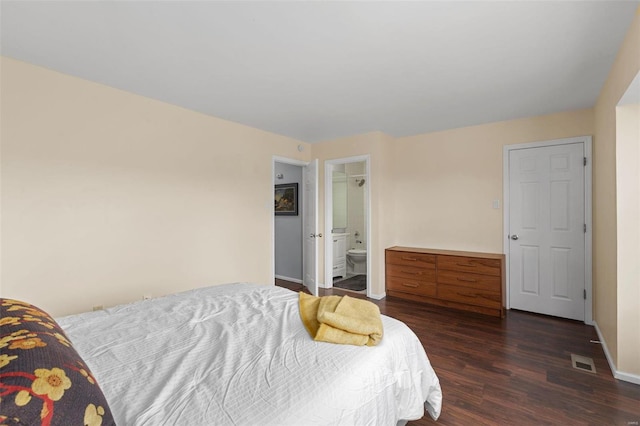 bedroom with dark wood-style flooring, baseboards, and visible vents