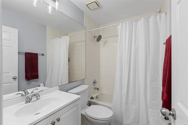 full bathroom featuring toilet, shower / bath combo, and vanity