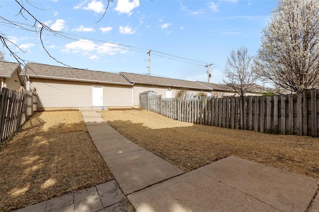 view of yard with a fenced backyard and a patio area