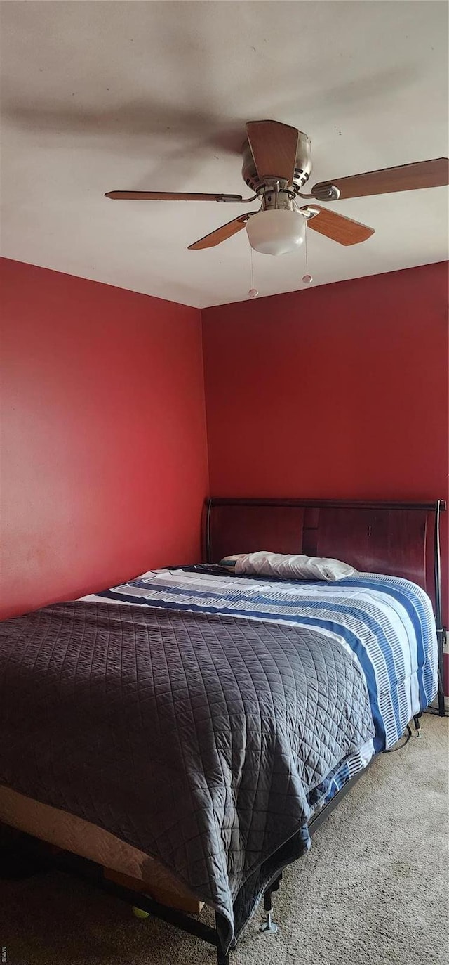 carpeted bedroom featuring a ceiling fan