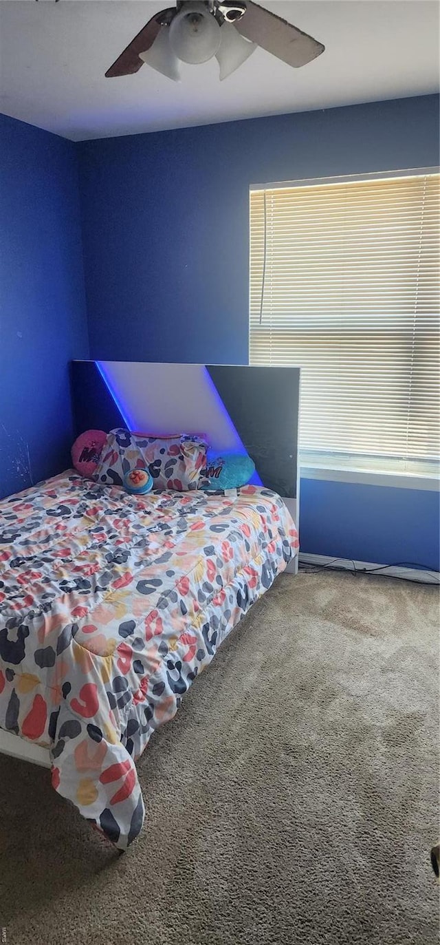 bedroom featuring a ceiling fan and carpet floors