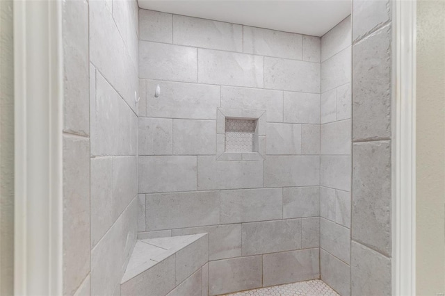 full bath featuring tiled shower