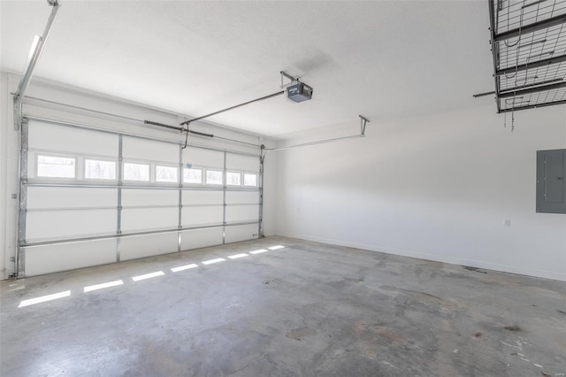 garage with baseboards, a garage door opener, and electric panel