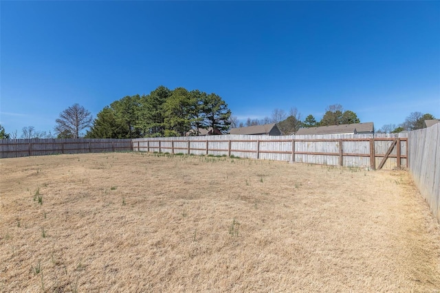 view of yard with a fenced backyard