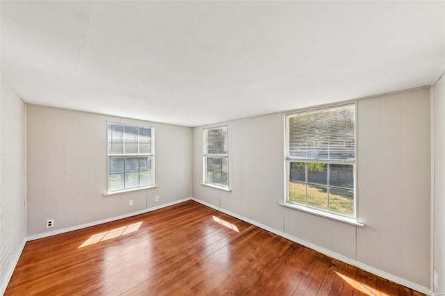 empty room featuring hardwood / wood-style flooring
