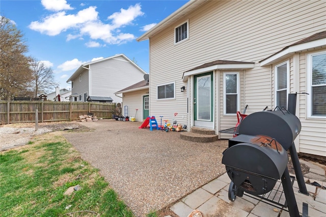 back of house featuring fence and a patio