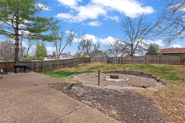 view of yard with an outdoor fire pit and a fenced backyard