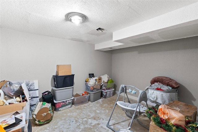 finished basement with a textured ceiling