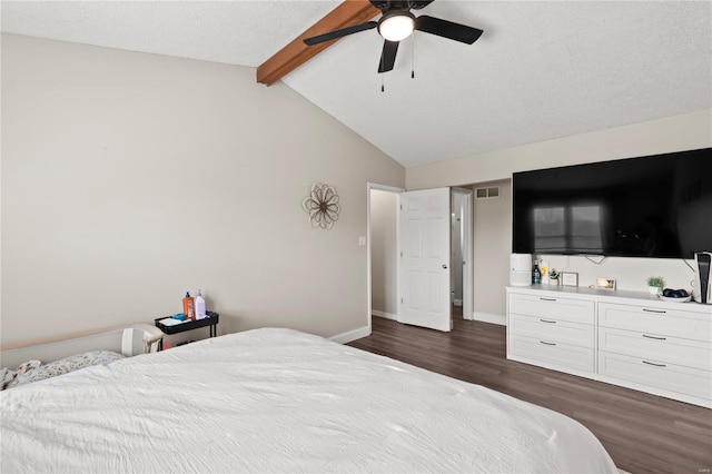 bedroom with vaulted ceiling with beams, a textured ceiling, dark wood-style floors, baseboards, and ceiling fan