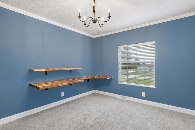 unfurnished room featuring baseboards, a notable chandelier, carpet flooring, and a textured ceiling