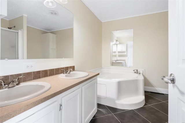bathroom with a bath, ornamental molding, a sink, and tile patterned floors