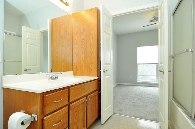 full bathroom featuring baseboards, a shower with shower door, visible vents, and vanity