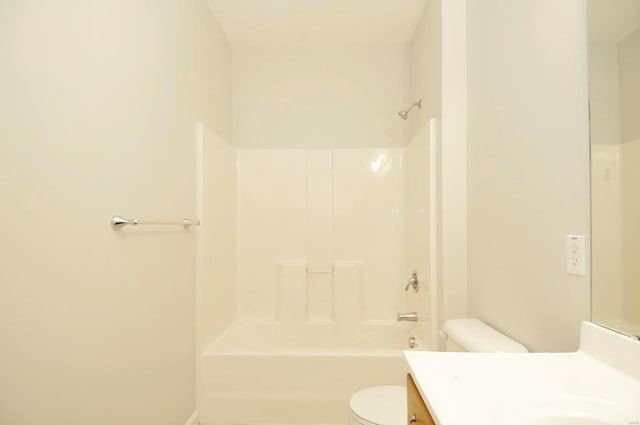full bath featuring vanity, shower / tub combination, and toilet