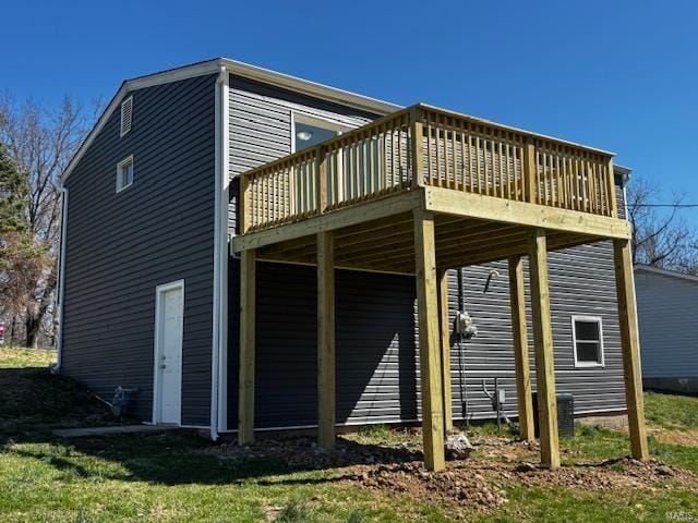 rear view of house featuring a deck