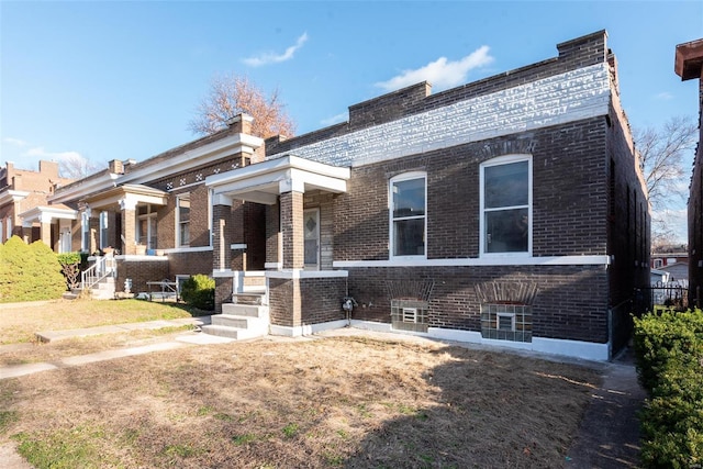 view of front of house with brick siding