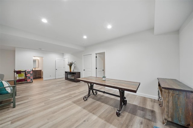 interior space featuring baseboards, light wood-type flooring, and recessed lighting
