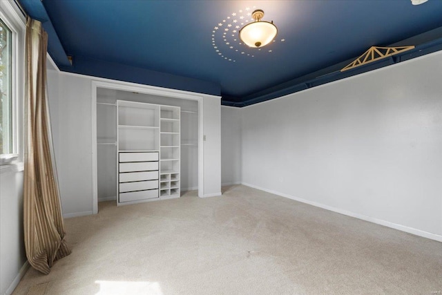 unfurnished bedroom featuring baseboards and carpet floors
