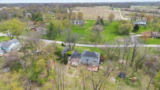 birds eye view of property with a rural view