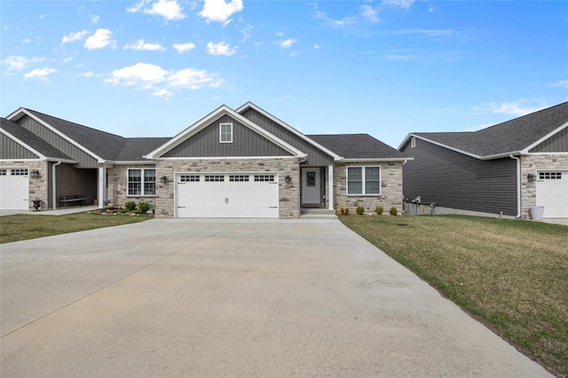 craftsman-style home with board and batten siding, a front yard, stone siding, an attached garage, and concrete driveway
