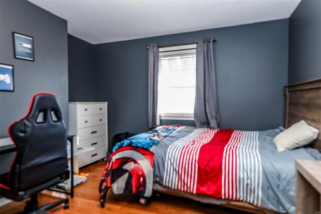 bedroom featuring wood finished floors