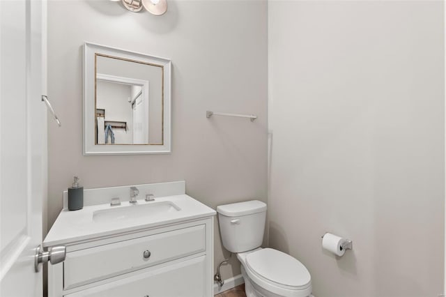 bathroom with toilet and vanity