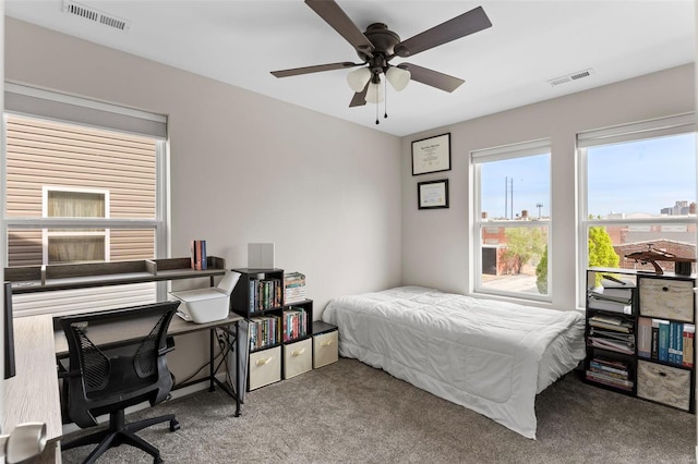 bedroom featuring carpet, visible vents, and a ceiling fan
