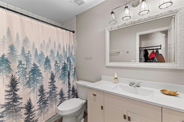 bathroom with toilet, visible vents, vanity, and a shower with shower curtain